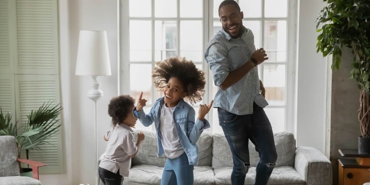 Cool daddy entertaining two children at home