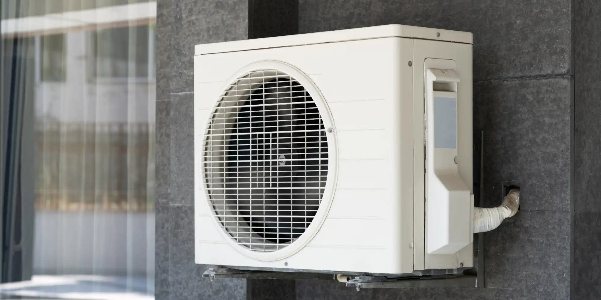 air conditioner and heat pump outside a home