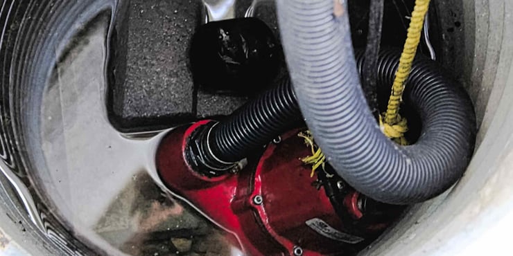 Sump pump in a pit.