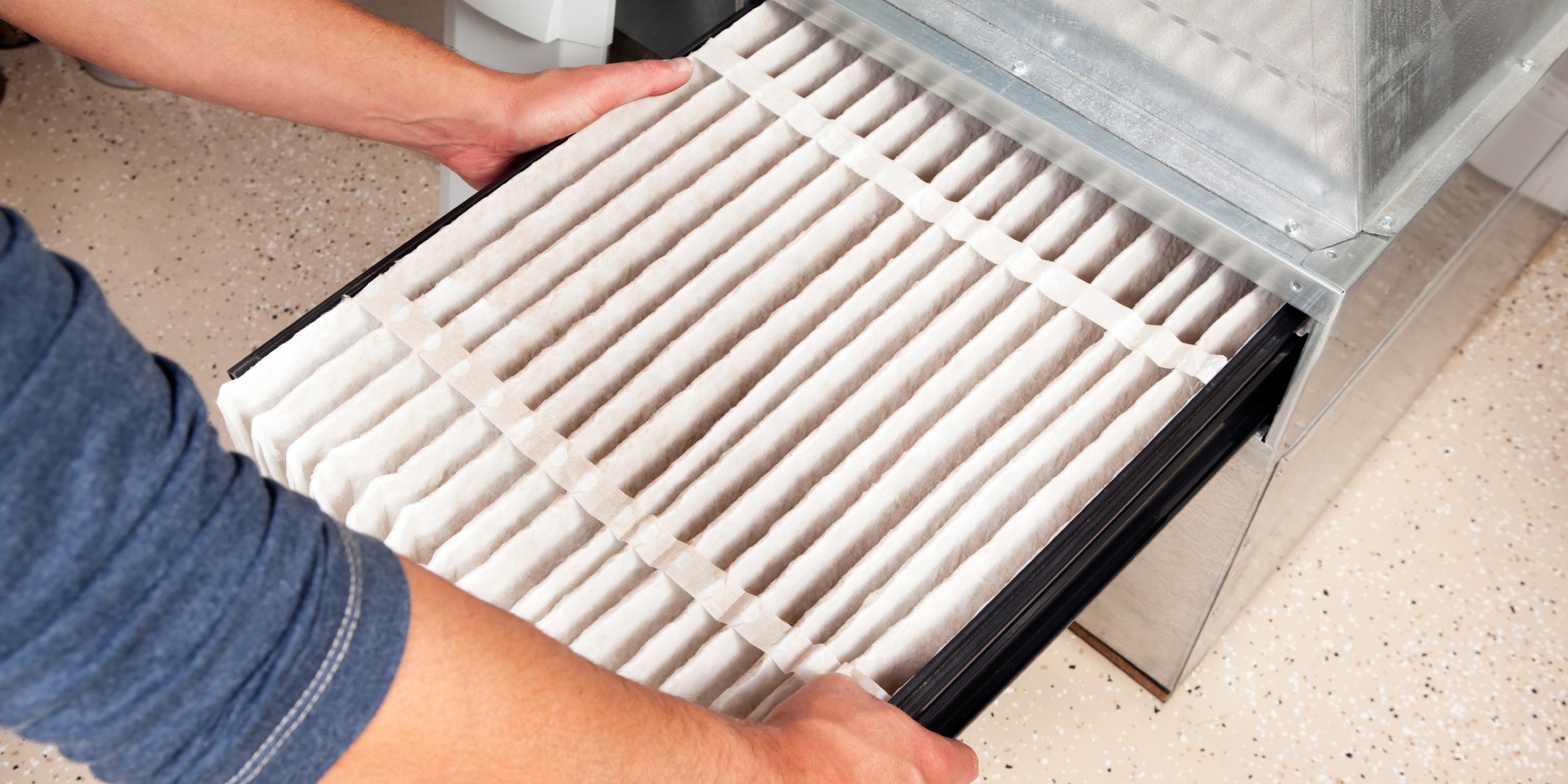 Wolseley PRO pipeline Blog person changing HVAC filter