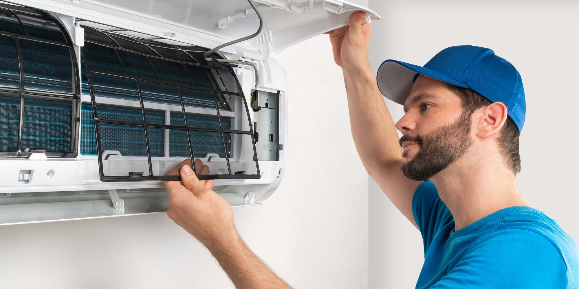 echnican worker checking the AC air filter