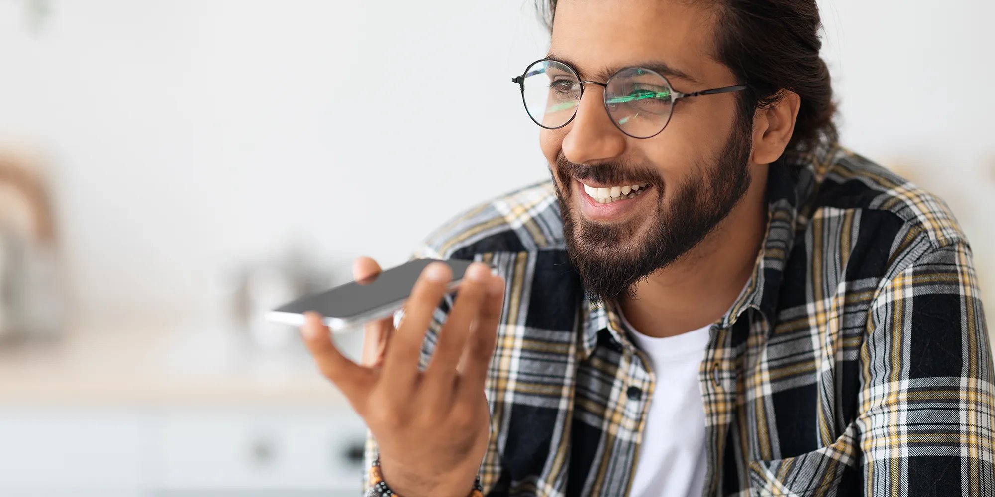 Contractor smiling, hold a cellphone, calling a customer back